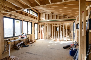 7. View across living area from kitchen toward bedrooms.